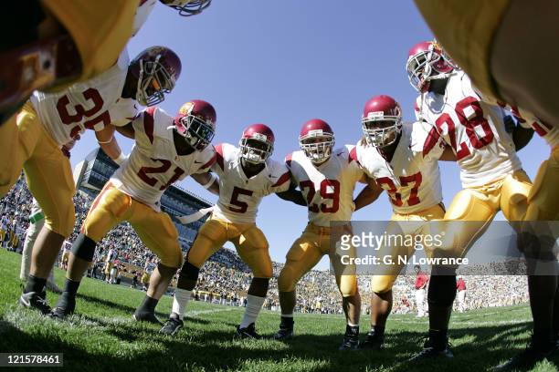 Players huddle around Reggie Bush prior to the USC Trojans game against the Notre Dame Irish at Notre Dame Stadium in South Bend, Indiana on October...