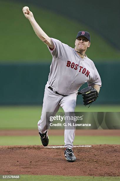 Curt Schilling of the Boston Red Sox throws a pitch against the Kansas City Royals at Kauffman Stadium in Kansas City, Mo. On August 25, 2005. The...