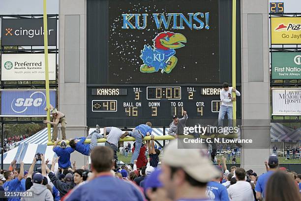 Fans of the Kansas Jayhawks tear down the goal post following a win over the Nebraska Cornhuskers at Memorial Stadium in Lawrence, Kansas on November...