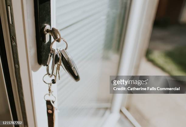 keys in a lock - lock stock pictures, royalty-free photos & images