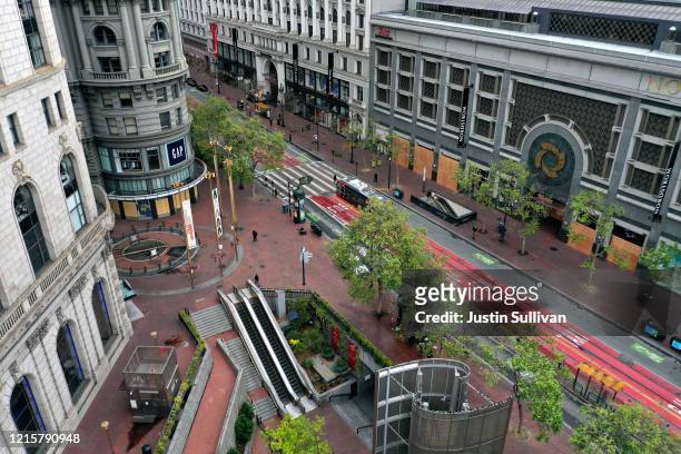 An aerial drone view of an empty Market Street and Powell Street Cable Car turnaround during the coronavirus pandemic on March 30, 2020 in San...