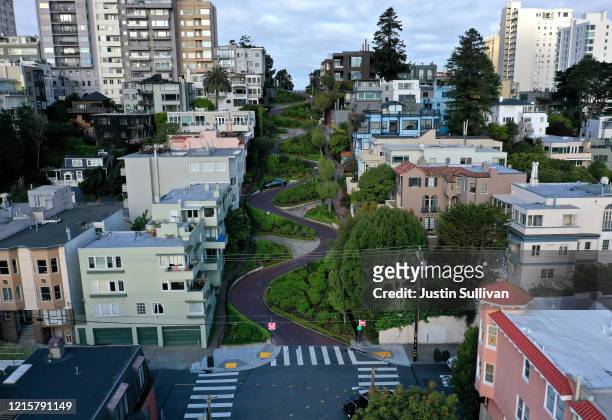 An aerial drone view of an empty Lombard Street tourist destination during the coronavirus pandemic on March 30, 2020 in San Francisco, California....