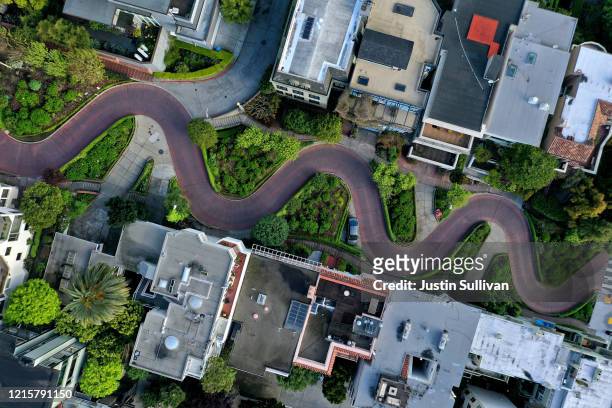 An aerial drone view of an empty Lombard Street tourist destination during the coronavirus pandemic on March 30, 2020 in San Francisco, California....