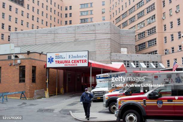 The scene outside of Elmhurst Hospital's trauma unit remains busy, with ambulances frequently leaving and arriving, dropping off patients, many who...