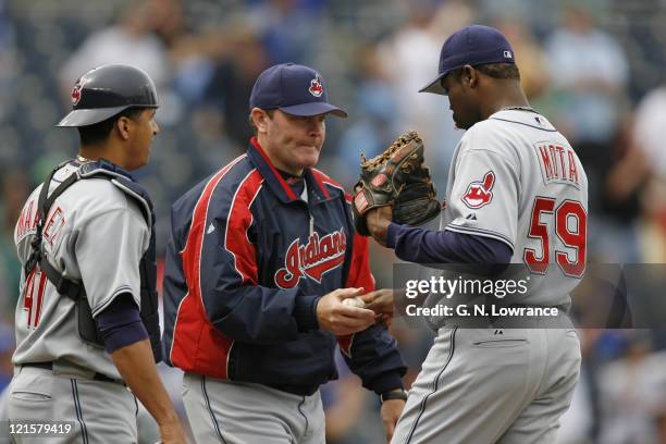 Indians manager Eric Wedge takes the ball from relief pitcher Guillermo Mota during action between the Cleveland Indians and Kansas City Royals at...