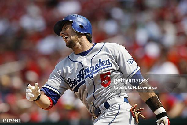 Nomar Garciaparra of the Dodgers fouls a ball off his foot during action between the Los Angeles Dodgers and St. Louis Cardinals at Busch Stadium in...