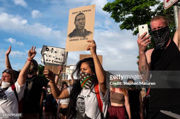 Protesters confront police outside the 3rd Police Precinct on May 27, 2020 in Minneapolis, Minnesota. Four Minneapolis police officers have been...