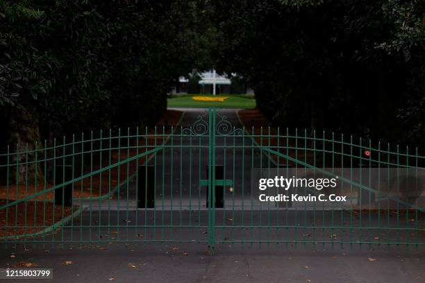 View of the locked gates at the entrance of Magnolia Lane off Washington Road that leads to the clubhouse of Augusta National on March 30, 2020 in...