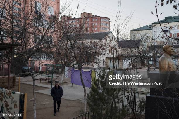 Man walks past a statue of Stalin in Derbent on Saturday March 9, 2019.