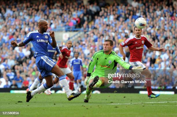 Nicolas Anelka of Chelsea shoots as Ben Foster of West Brom closes in during the Barclays Premier League match between Chelsea and West Bromwich...