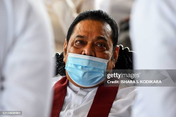 Sri Lanka's Prime Minister Mahinda Rajapaksa attends a laying in state ceremony for late tea plantation trade union leader and government minister...