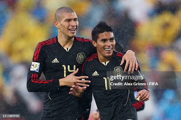 Ulises Davila of Mexico celebrates his team's first goal with team mate Jorge Enriquez during the FIFA U-20 World Cup 2011 3rd place playoff match...