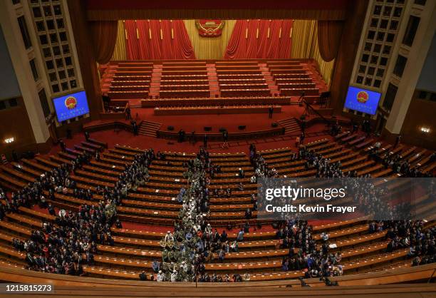 Communist Party delegates file out of the closing session of the National People's Congress, which included a vote on a new draft security bill for...