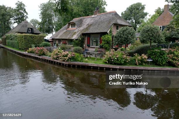 Thathed roof houses stand on September 6 at Giethoorn town in the province of Overijssel, Netherlands. Giethoorn, also known as "Venice of Holland"...