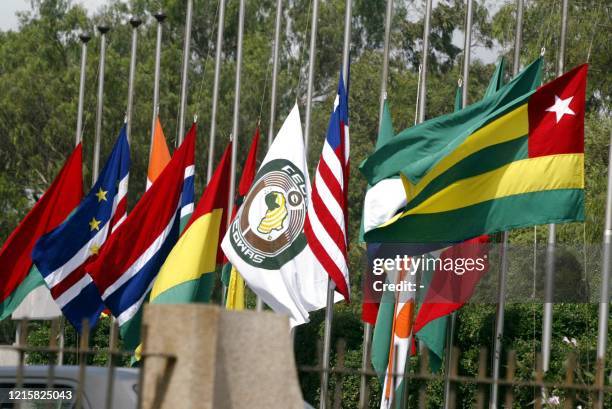 Flags of ECOWAS member countries fly at half mast to honour late Togolese President Gnassingbe Eyadema at the Lome headquater of the ECOWAS bank for...