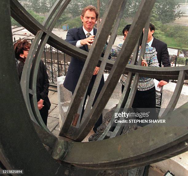 British Prime Minister Tony Blair and his wife Cherie explore various ancient astronomical instruments at the Chinese Ancient Observatory after an...