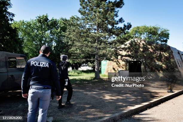 Police man supervised a migrant in the police station of the Italian border town Fernetti after been discovered cross the border between Italy and...