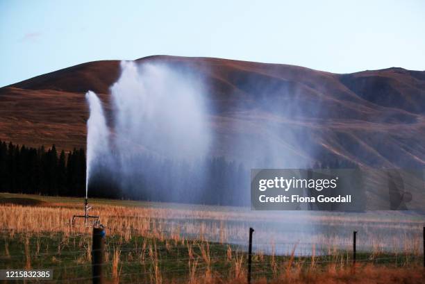 Irrigation at work to water the pasture at Godley Peaks Station on March 22, 2020 in Tekapo, New Zealand. Rob Glover from Godley Peaks Station in...