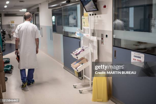 Doctor walks in the intensive care unit of Saint-Louis hospital of the AP-HP in Paris, on May 28, 2020 as France eases lockdown measures taken to...