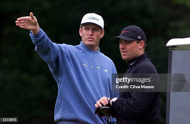 Tom Moody of the Australia cricket team shows the way to vice captain Shane Warne during a round of golf at the Moortown Golf Club, Leeds, ahead of...