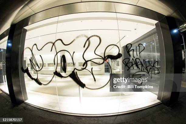 March 30 MANDATORY CREDIT Bill Tompkins/Getty Images Grafitti that reads RIP BARNEYS on the glass window of the former BARNEYS retail clothing...