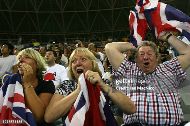 Chris Hoy's parents David and Carol celebrate after he wins gold in the Keirin Final held at the Laoshan Velodrome during Day 9 of the 2008 Beijing...