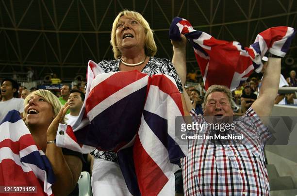 Chris Hoy's parents David and Carol celebrate after he wins gold in the Keirin Final held at the Laoshan Velodrome during Day 9 of the 2008 Beijing...