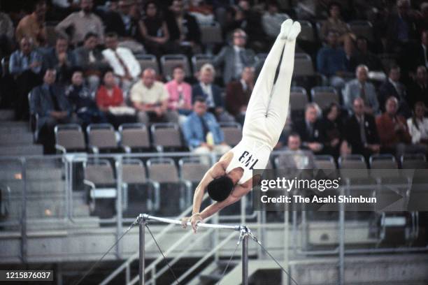 Sawao Kato of Japan competes in the Horizontal Bar of the Artistic Gymnastics Men's Team during the Munich Olympic Games at the Sporthalle on August...