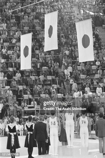 Bronze medalist Akinori Nakayama of Japan, gold medalist Sawao Kato of Japan and Silver medalist Eizo Kenmotsu of Japan stand on the podium for the...