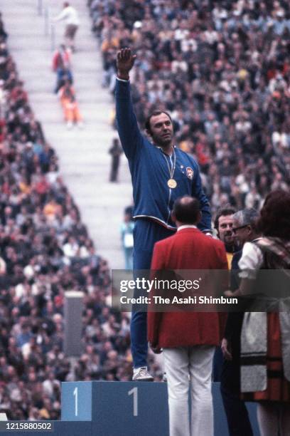 Gold medalist Ludvik Danek of Czechoslovakia celebrates on the podium at the medal ceremony for the Athletics Men's Discus Throw during the Munich...