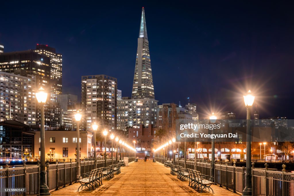 Night view of Pier 7 and San Francisco skyscrapers