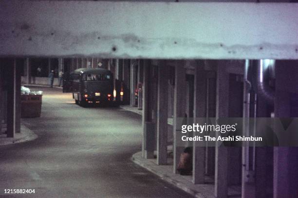 Bus carrying terrorist group 'Black September' and hostages sits at the entrance underneath the Israeli athletes' residence building before heading...