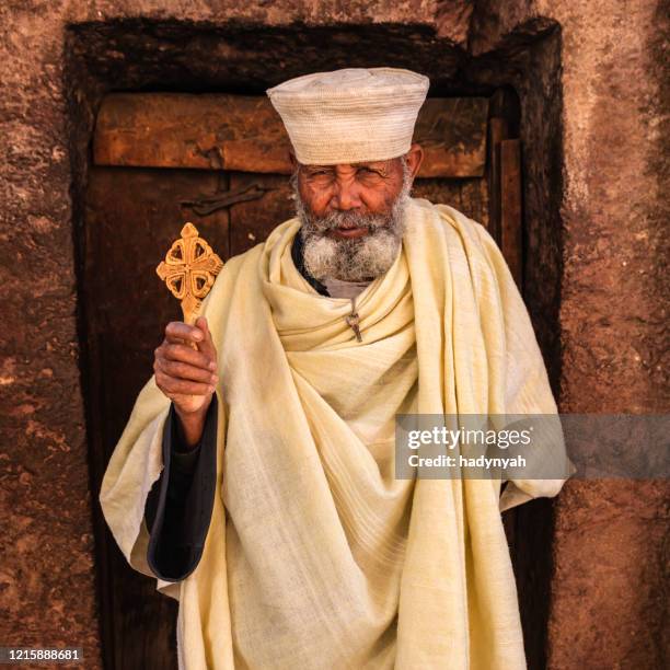 catholic priest of rock-hewn churches of lalibela. ethiopia,east africa - paparazzi x posed stock pictures, royalty-free photos & images