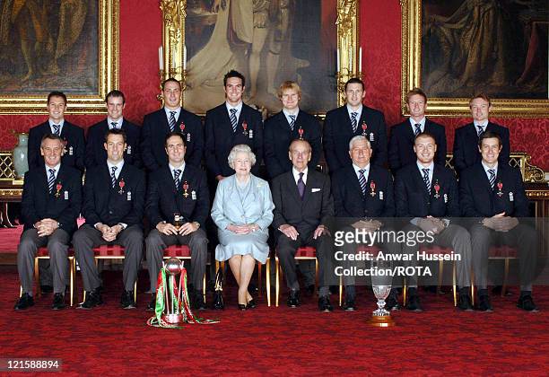 Members of England's 2005 Ashes winning Cricket team sit with Britain's Queen Elizabeth II and the Duke of Edinburgh in Buckingham Palace, London,...