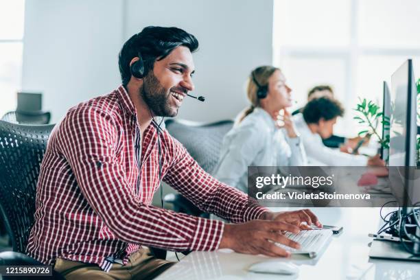 answering your call with a smile - call center agents imagens e fotografias de stock