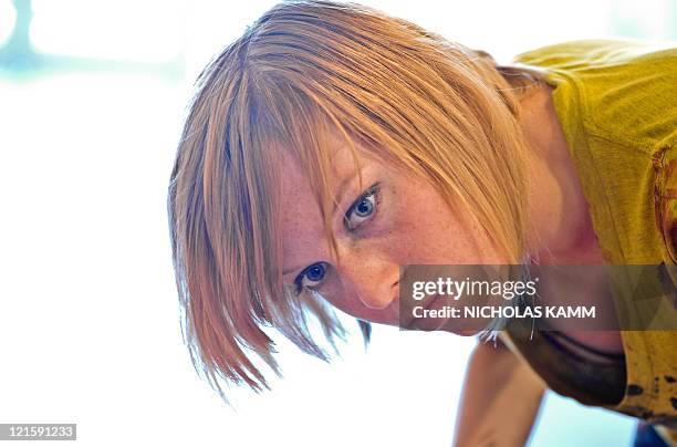 Artist Alexa Meade paints model Will Claybaugh during a performance at the Irvine Contemporary gallery in Washington on August 20, 2011. Meade paints...