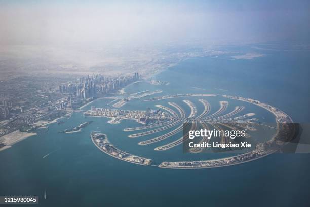 aerial view of the palm jumeirah in palm island seen from airplane, dubai, united arab emirates - palm-jumeirah imagens e fotografias de stock