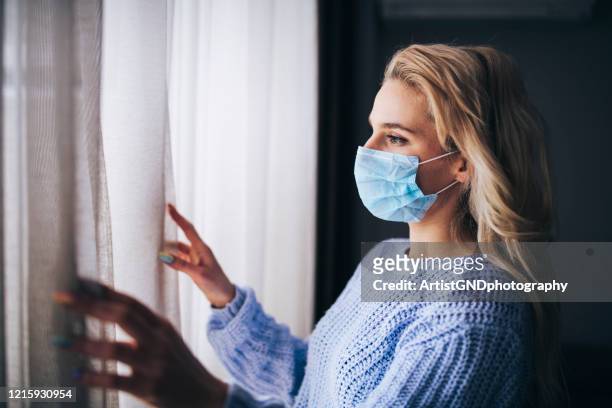 woman in isolation at home for virus outbreak. - lockdown stock pictures, royalty-free photos & images