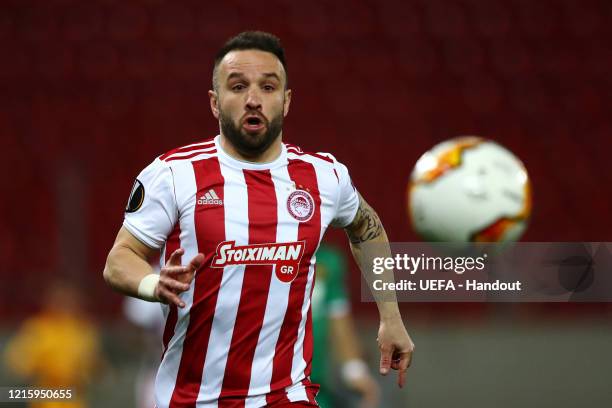 In this handout image provided by UEFA, Mathieu Valbuena of Olympiacos in action during the UEFA Europa League round of 16 first leg match between...