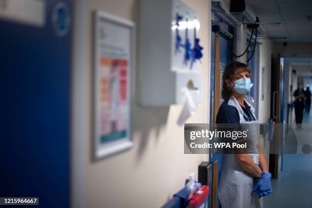 Rehab Support worker stands in a corridor as the first patients are admitted to the NHS Seacole Centre at Headley Court, Surrey, a disused military...