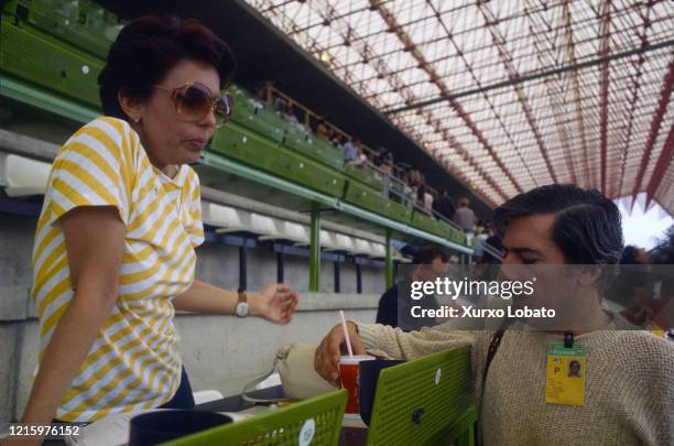 Peruvian writer Mario Vargas Llosa is seen working as a journalist for La Vanguardia newspaper at the Riazor Stadium covering the match between Spain...