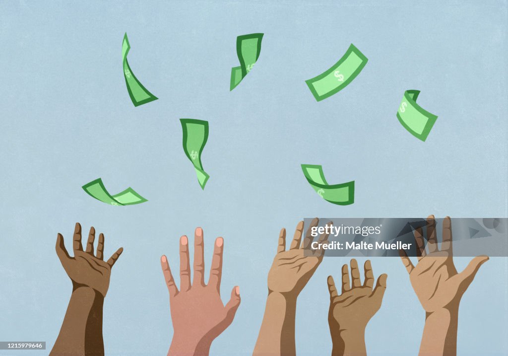 Hands reaching for falling money
