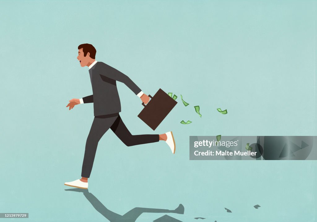 Businessman running with briefcase full of cash