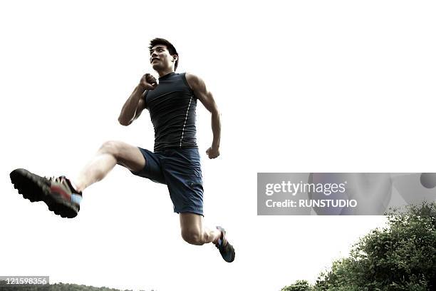 young man,outdoor exercise,running - ジョギング ストックフォトと画像