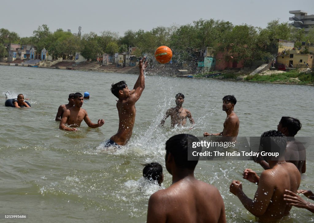 People take a dip in river Yamuna as the temperature has suddenly gone up...