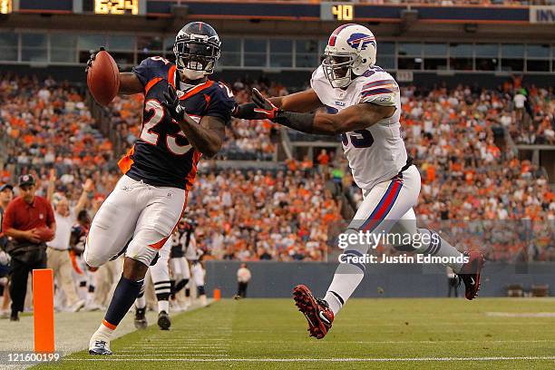 Running back Willis McGahee of the Denver Broncos beats linebacker Reggie Torbor of the Buffalo Bills to the end zone for a touchdown in the second...