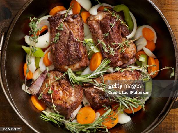 preparing red wine braised beef short rib stew - braised stock pictures, royalty-free photos & images