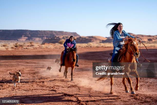 young navajo siblings riding their horses - horseback riding arizona stock pictures, royalty-free photos & images