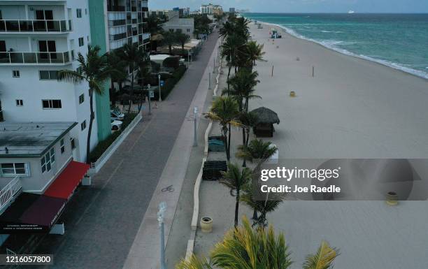 An aerial drone view shows the empty boardwalk on March 31, 2020 in Hollywood, Florida. The City of Hollywood along with other cities along the...
