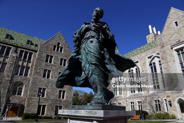 View of the statue of Saint Ignatius Loyola at the campus of Boston College on March 31, 2020 in Chestnut Hill, Massachusetts. Students at...